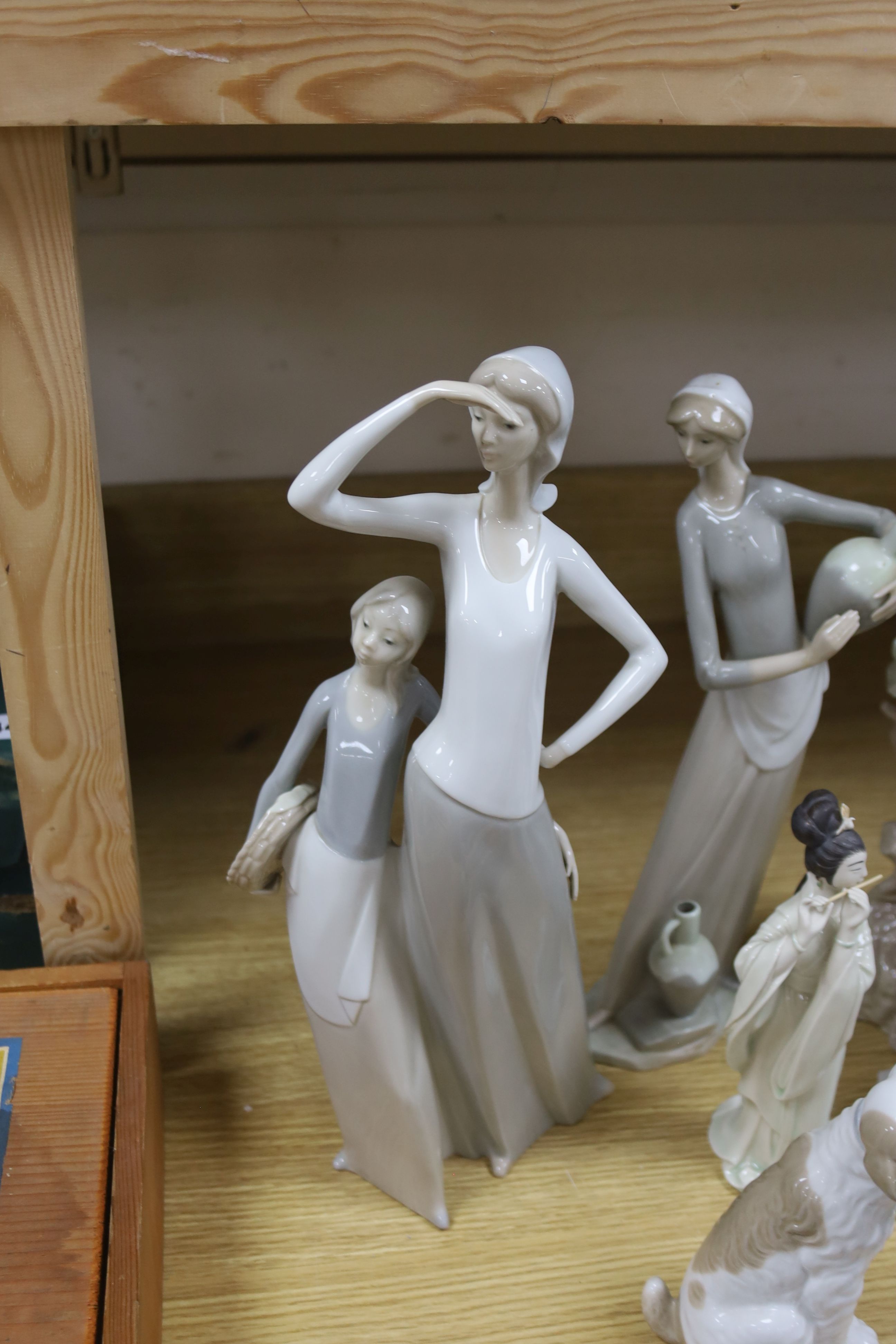 Four pieces of Lladro porcelain and assorted Nao etc (10)